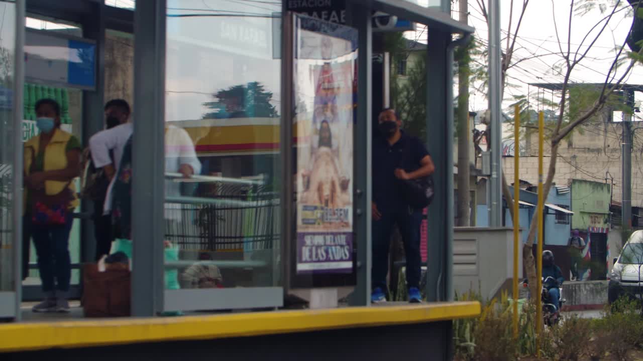 People Waiting at a Bus Stop in San Rafael