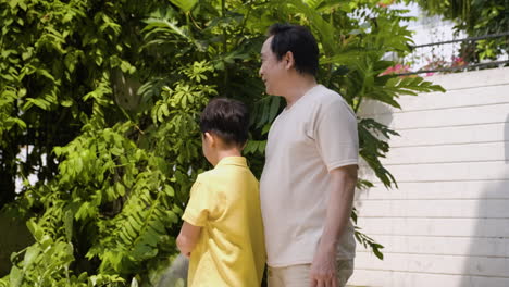 Asian-man-and-boy-in-the-backyard