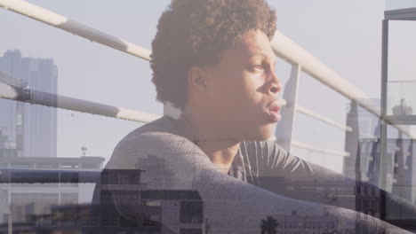 animation of african american man resting after running over cityscape