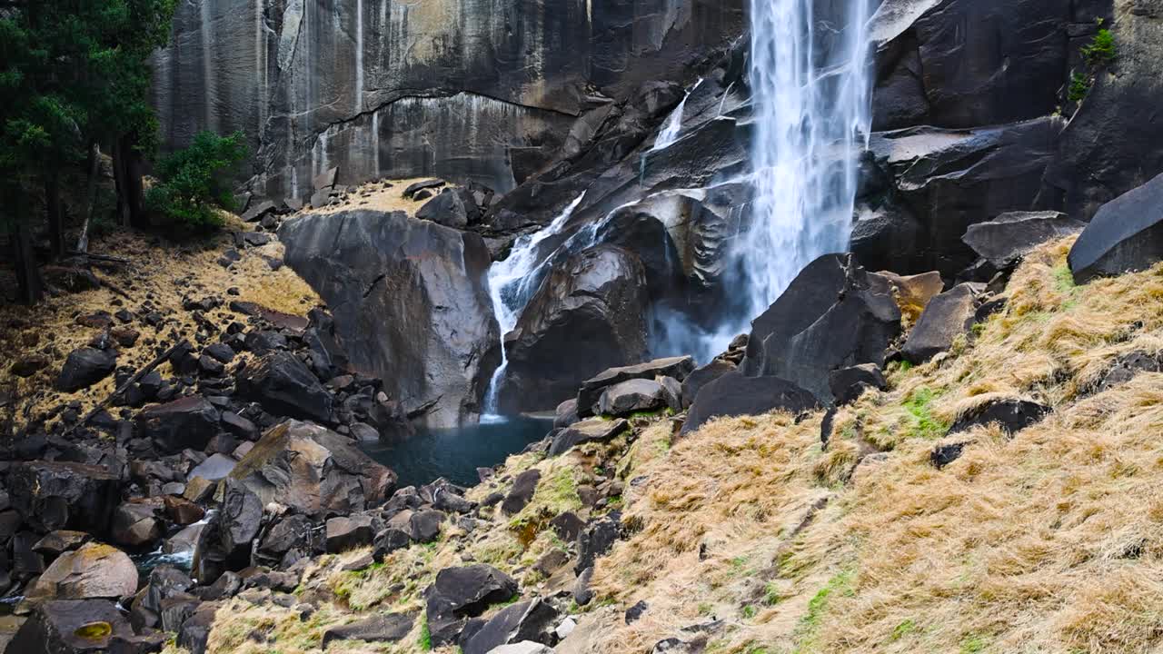 lower vernal falls rushing hard on a winter day Yosemite National Park PAN UP SLOW MOTION