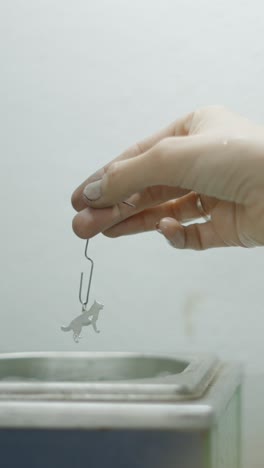 cleaning a metal dog charm