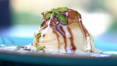 delicious turkish dessert with pistachios and chocolate sauce