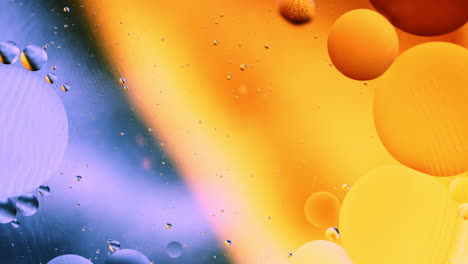 Real-close-up-oil-bubbles-in-water-rotation-with-color-gradient-abstract-mixing-background