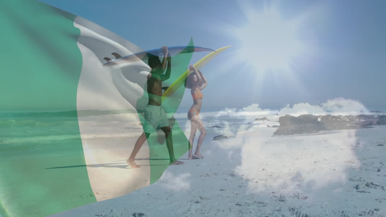 Walking on sunny beach, surfers carrying Nigerian flag with animation overlay