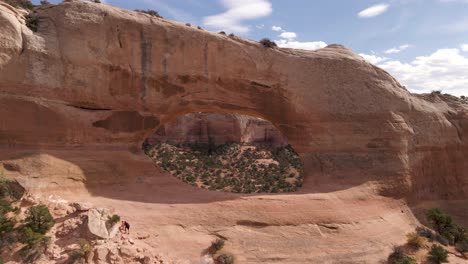 Aerial-perspective-of-big-hole-in-Wilson-arch-rock-formation,-United-States