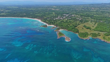 playa los coquitos beach and surrounding landscape, cabrera in dominican republic. aerial drone panoramic view