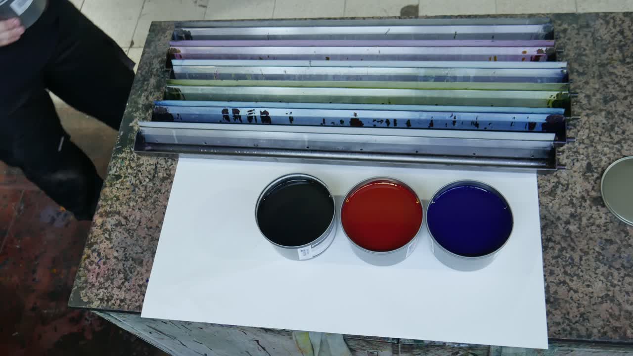 printer paint cans, cmyk colors