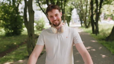 jogger runner man raises thumbs up agrees gives positive reply happy about marathon achievement