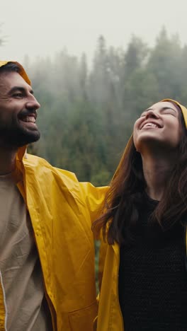 couple enjoying a rainy day in the forest