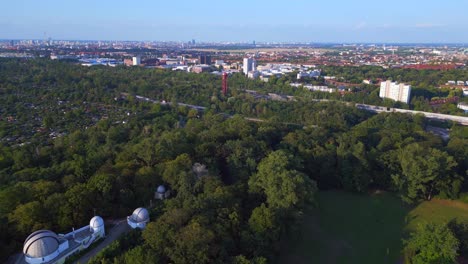 Smooth-aerial-top-view-flight-Berlin-city-Public-swimming-pool-Germany-in-Europe,-summer-day-2023