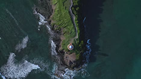 aerial overhead shot of island with crashing waves at senator resort in puerto plata