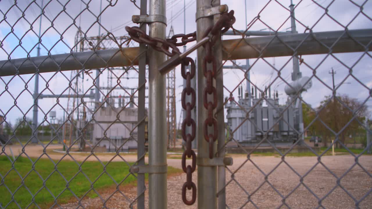 Chained Fence Surrounding Electric Power Station – Industrial Infrastructure