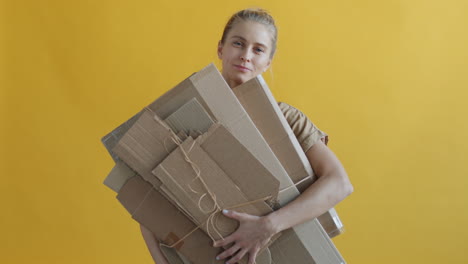 Woman Holding Recycled Cardboard Boxes