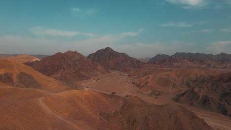 drone shot of desert mountains and dunes of southern israel