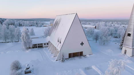 aerial view around the church of salla , winter sunset in lapland, finland