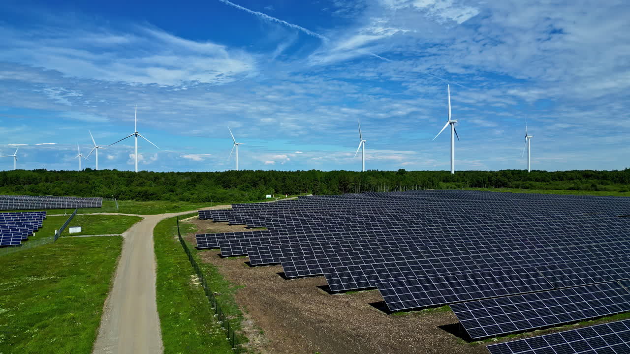 Large Solar Panel Array and Wind Turbines under a Blue Sky