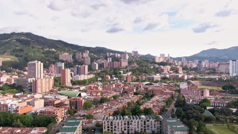 aerial vertigo effect over dense populated city medellin in colombia