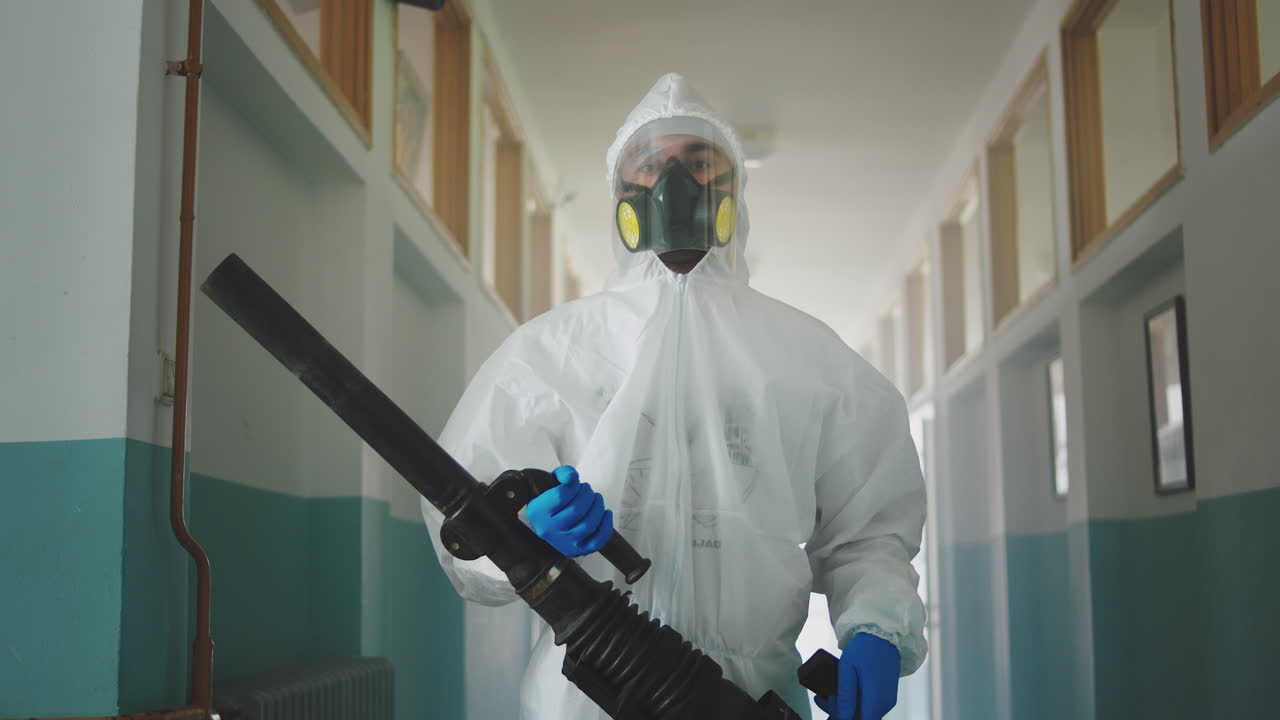 Disinfection Worker in Hazmat Suit