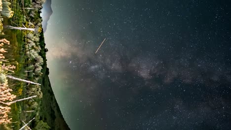 old fence in the utah west desert - panning vertical milky way time lapse