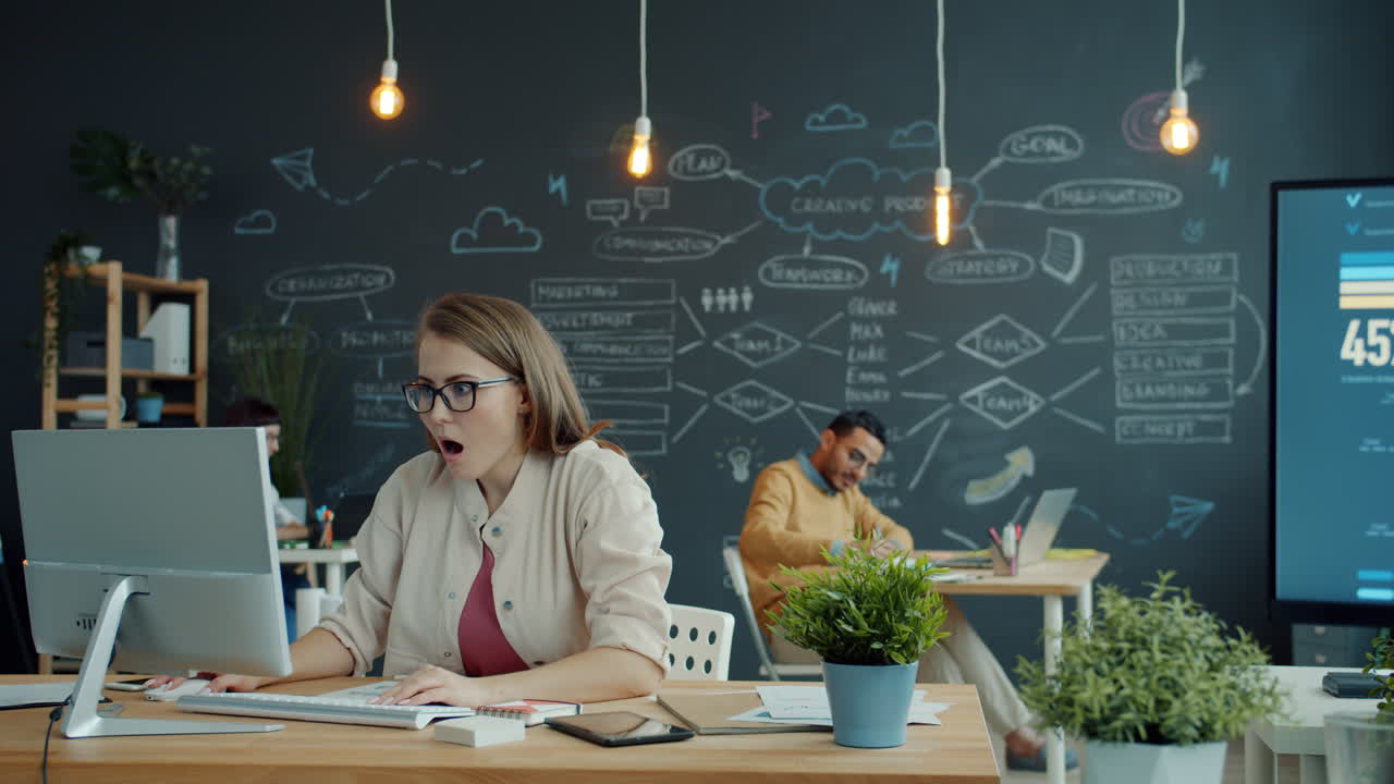 Happy Team Celebrating Success in Modern Office