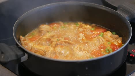 Cooking-chicken-curry-in-a-cooking-pan-,