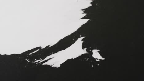 Video-of-close-up-of-strokes-of-black-paint-on-white-background