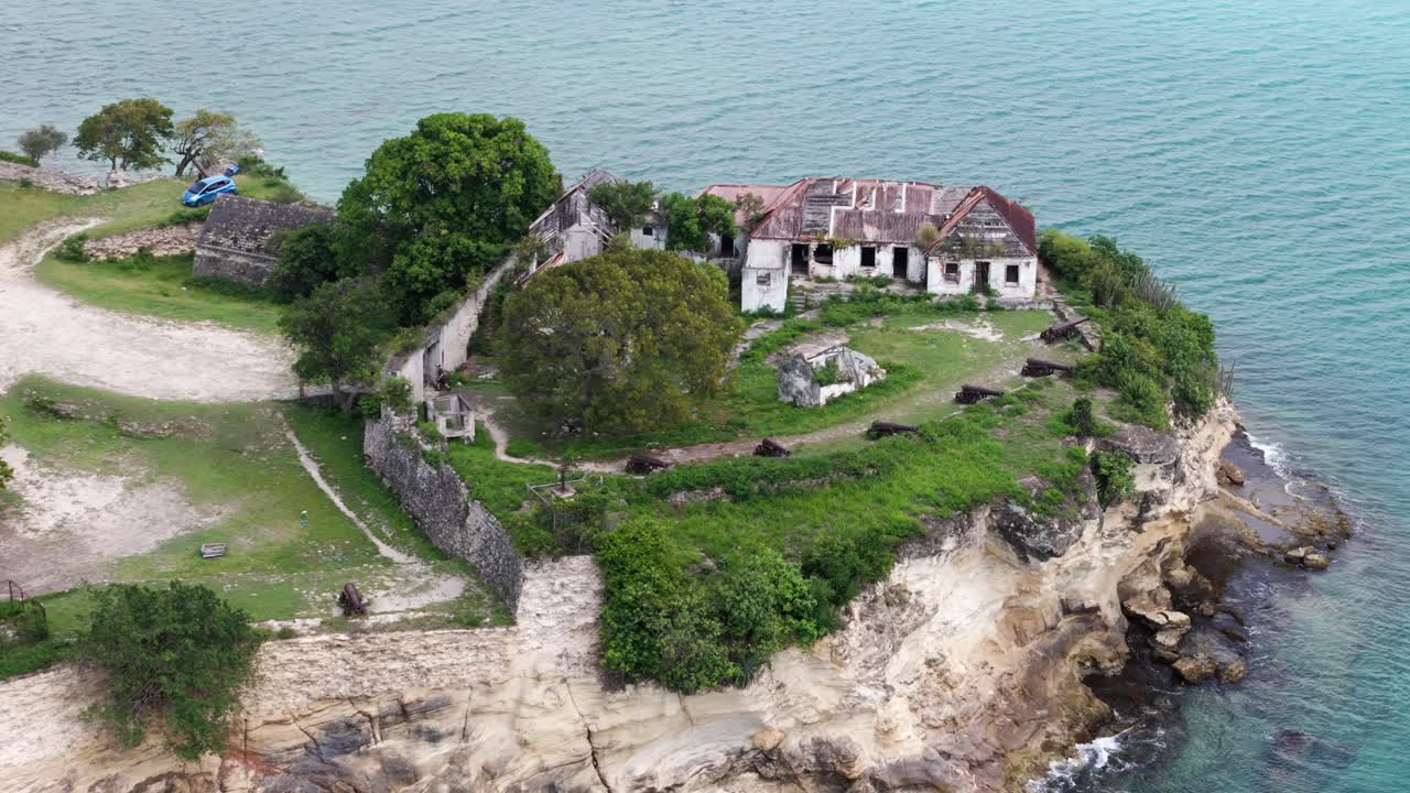 Ruins of Fort James overlook turquoise waters and rugged cliffs on Antigua's scenic coast