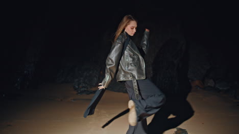 fashion girl modeling beach in jacket at night zoom on. woman spinning in dance