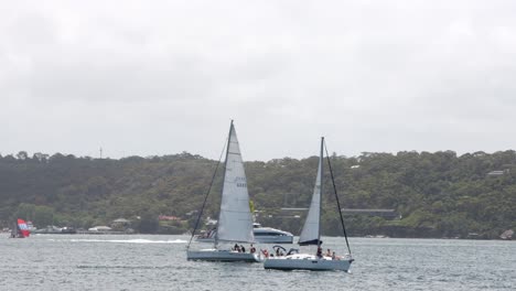 Two-sailing-Boats-are-crossing-each-other-with-a-fast-Ferry-in-Background