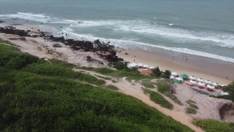 beautiful brazilian trails overlooking beach, beach umbrellas and bars