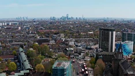 Dolly-back-Aerial-drone-shot-of-Archway-road-A1-towards-Central-London-skyline