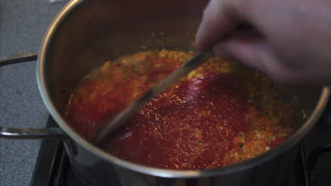 Stirring-Bolognese-Sauce,-Tomato-sauce-and-vegetables
