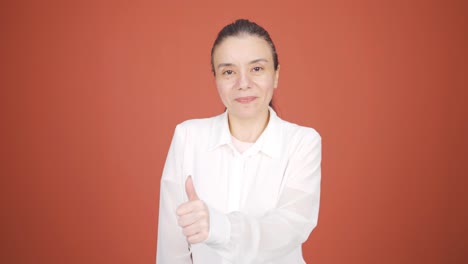 woman making positive gesture at camera.