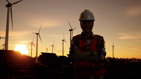 engineer at a renewable energy facility at sunset