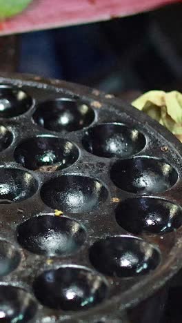 cooking process of kanom krok in bangkok market