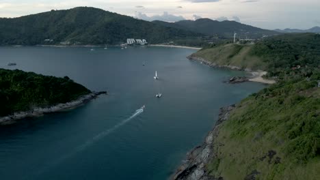 Boats-arriving-to-pier-between-mountains