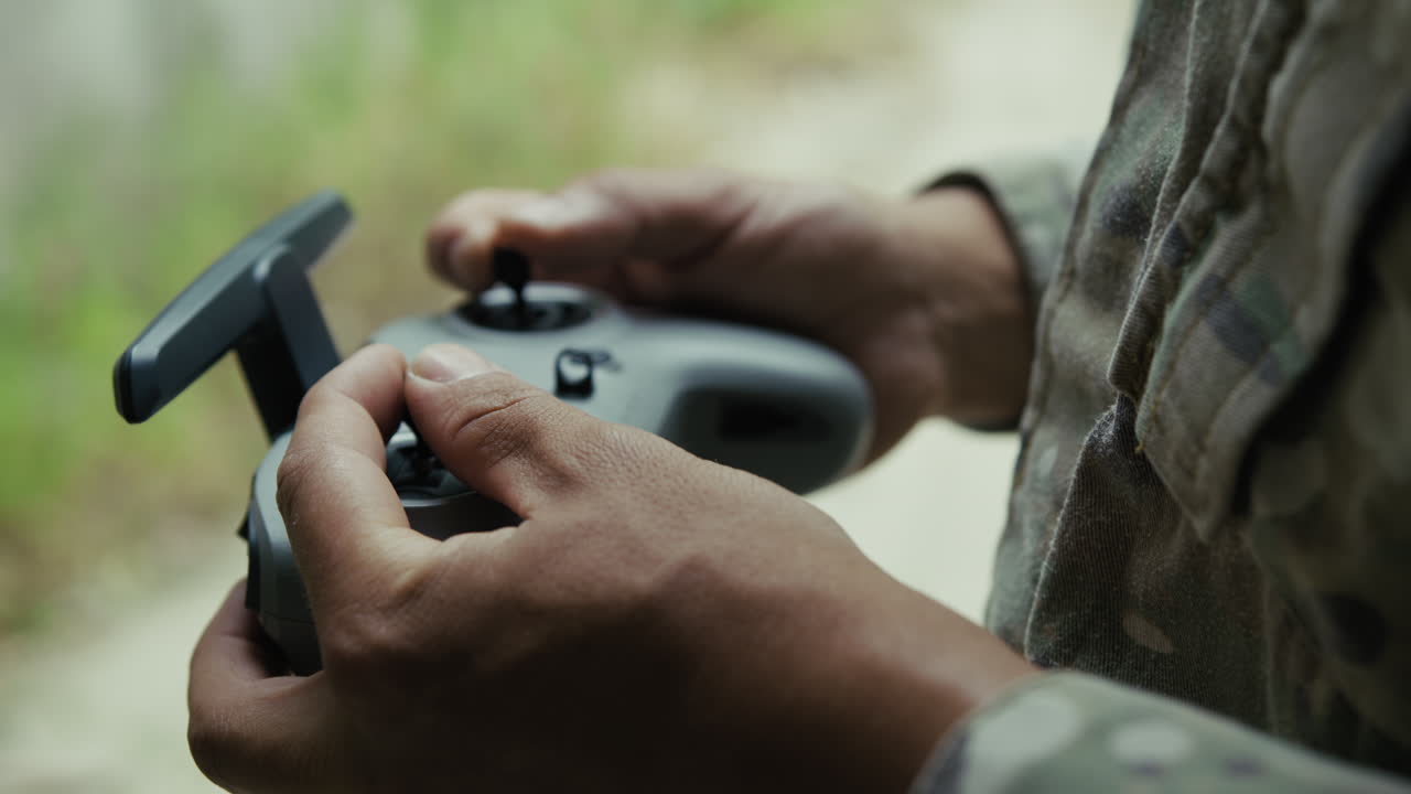 A Soldier Practices Piloting a Military Drone with Radio Control for War
