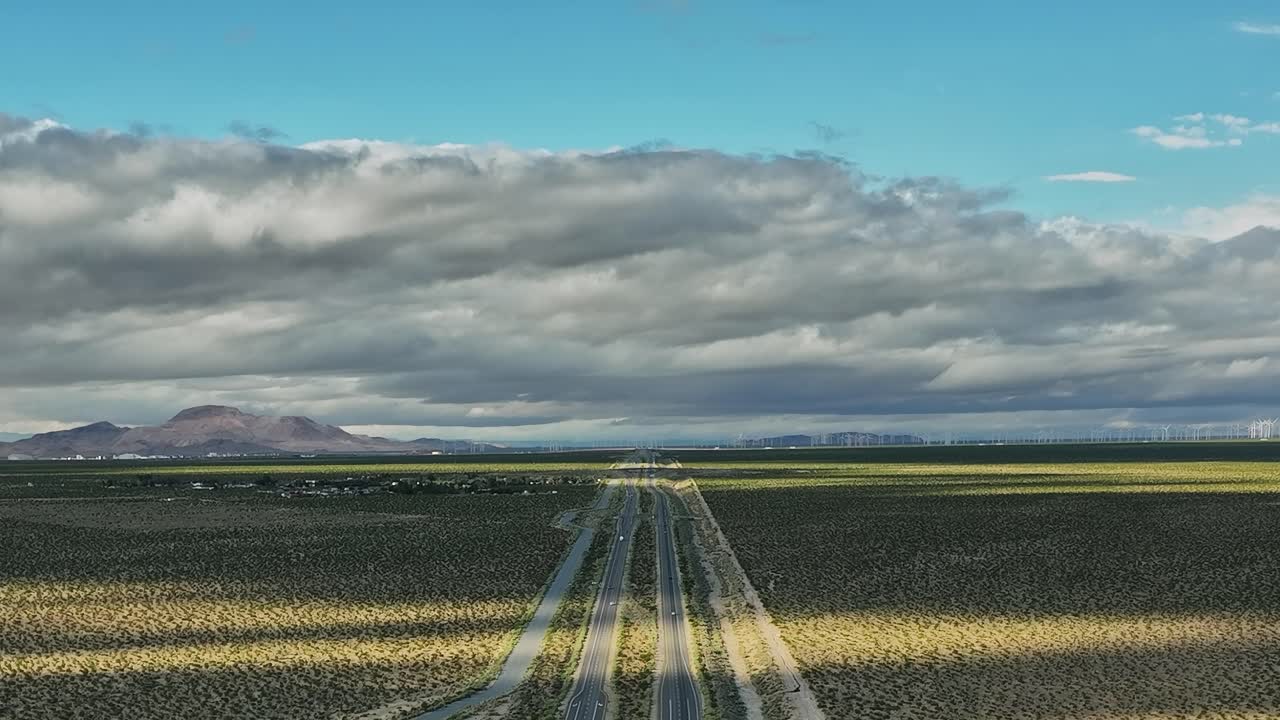Wide view of open land with roads and mountains in the USA