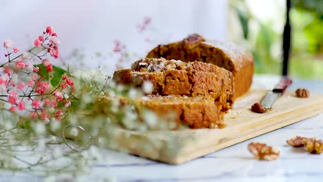 a delightful moment unfolds as a freshly baked cake emerges from the oven, placed gracefully on the table for a tempting treat