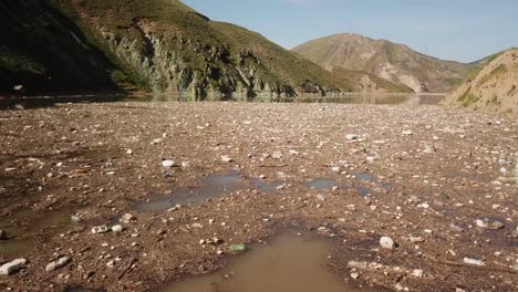 drone footage captures plastic pollution along the coastline with industrial waste and floating garbage damaging the environment and threatening industrial plastic polluted recycling waste marine life
