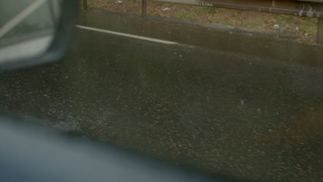 cars driving on wet slippery asphalt road on rainy day