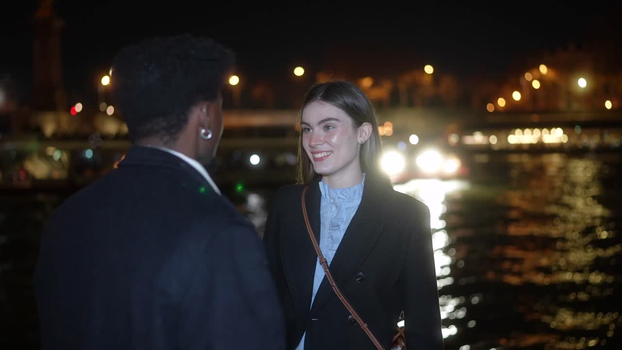 Couple Talking by the River at Night