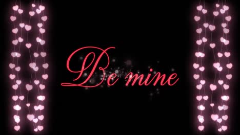 Animation-of-Be-Mine-written-in-red-letters-with-two-hearts-garlands-on-black-background
