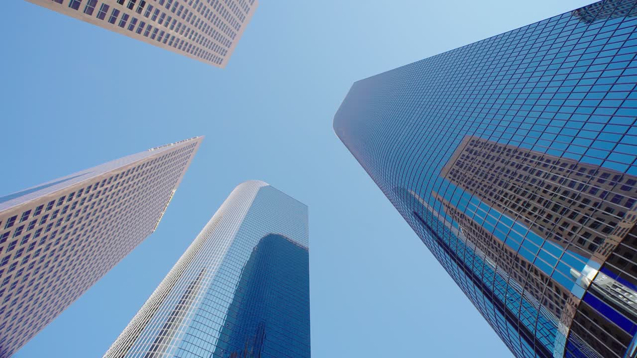 Business and finance concept, looking up at office building architecture in the financial district. Modern skyscrapers in Downtown Los Angeles