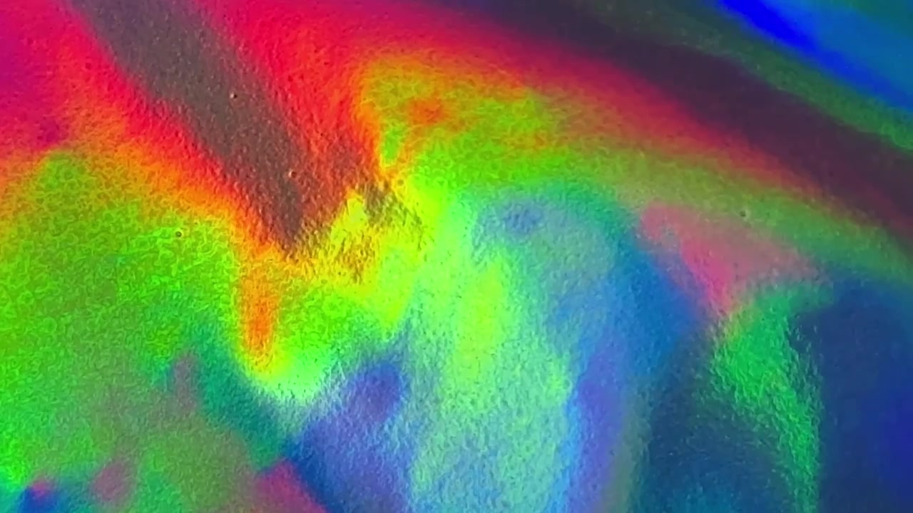 Abstrakte holografische Folientextur mit lebendigem Farbwechsel