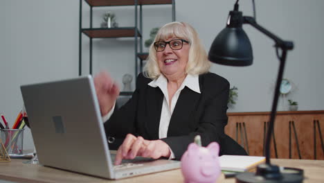 elderly business woman winner gets good news, positive exam results, opportunity, celebrates victory