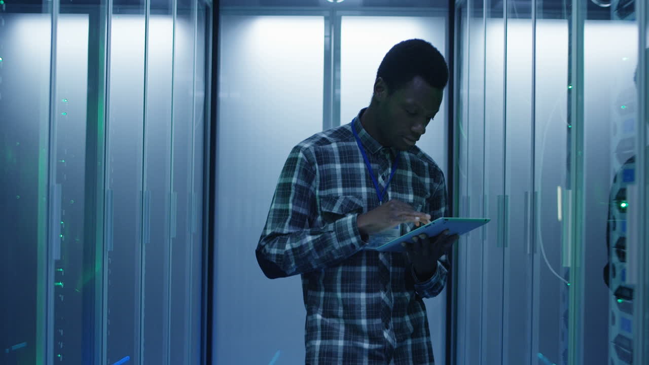 IT Technician Working in a Server Room