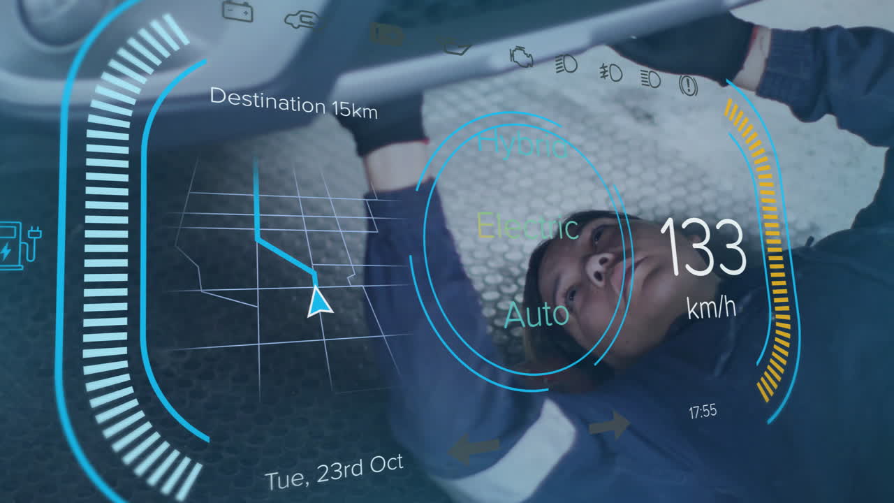 woman mechanic lying under car in workshop, overlaying automotive HUD with route, speedometer icons