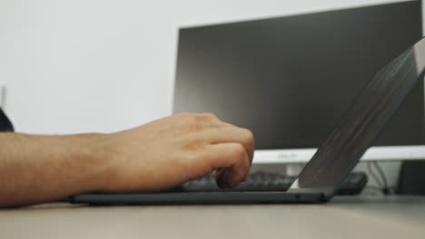 typing on a laptop