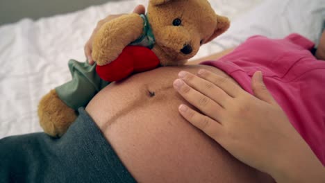 happy pregnant woman sleeping on bed in bedroom.